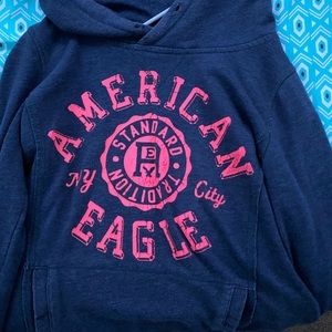 American Eagle pull over hoodie- navy blue. pink lettering